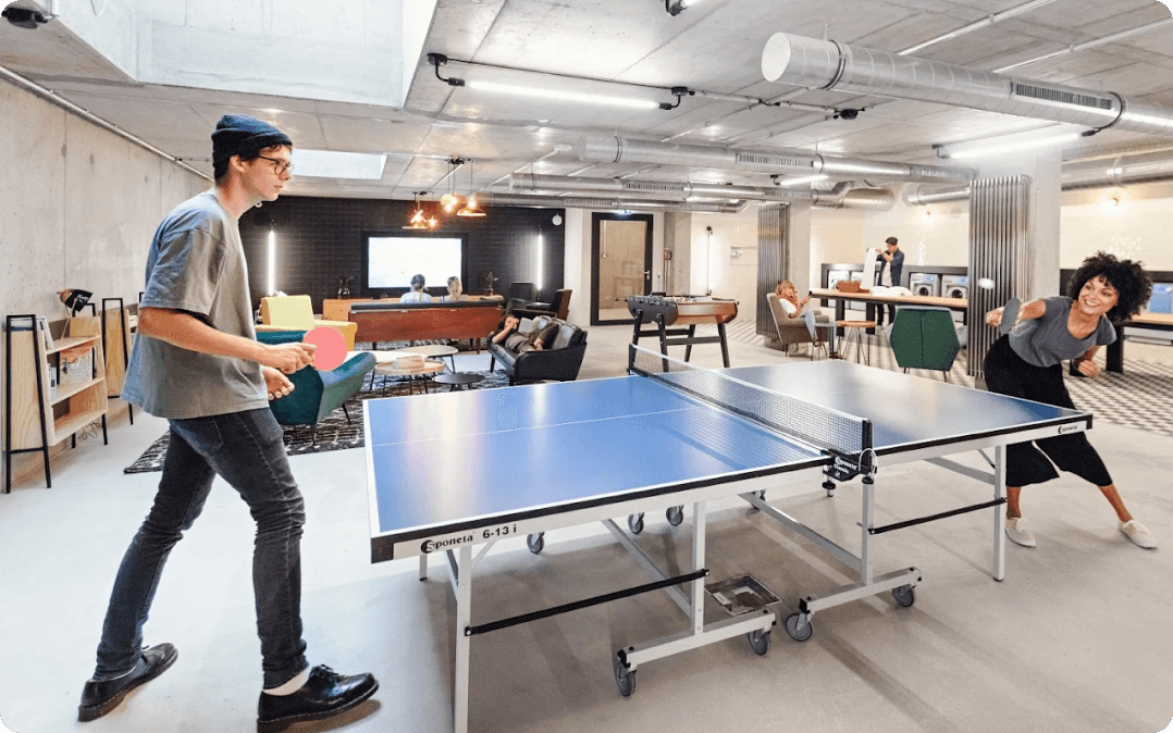 Residents playing table tennis in a Neon Wood common area