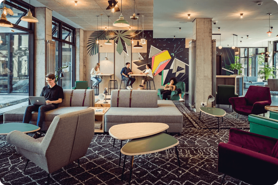 Students studying and relaxing in a Neon Wood community lounge